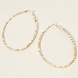 Gold Dipped Textured Oval Hoop Earrings